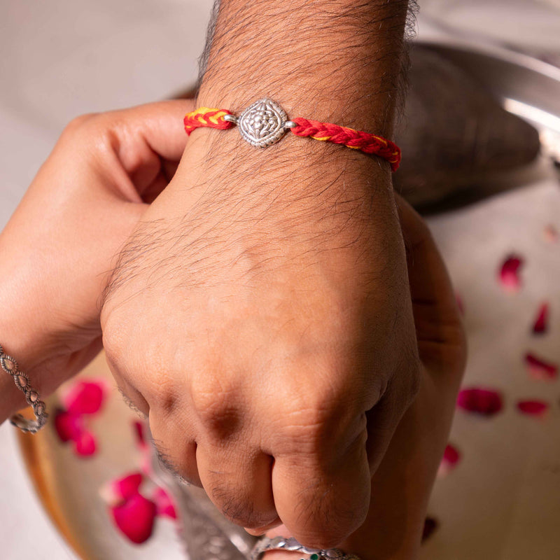 925 pure silver intricate flora rakhi