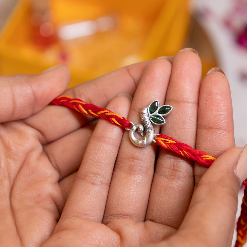 925 pure silver intricate peacock rakhi