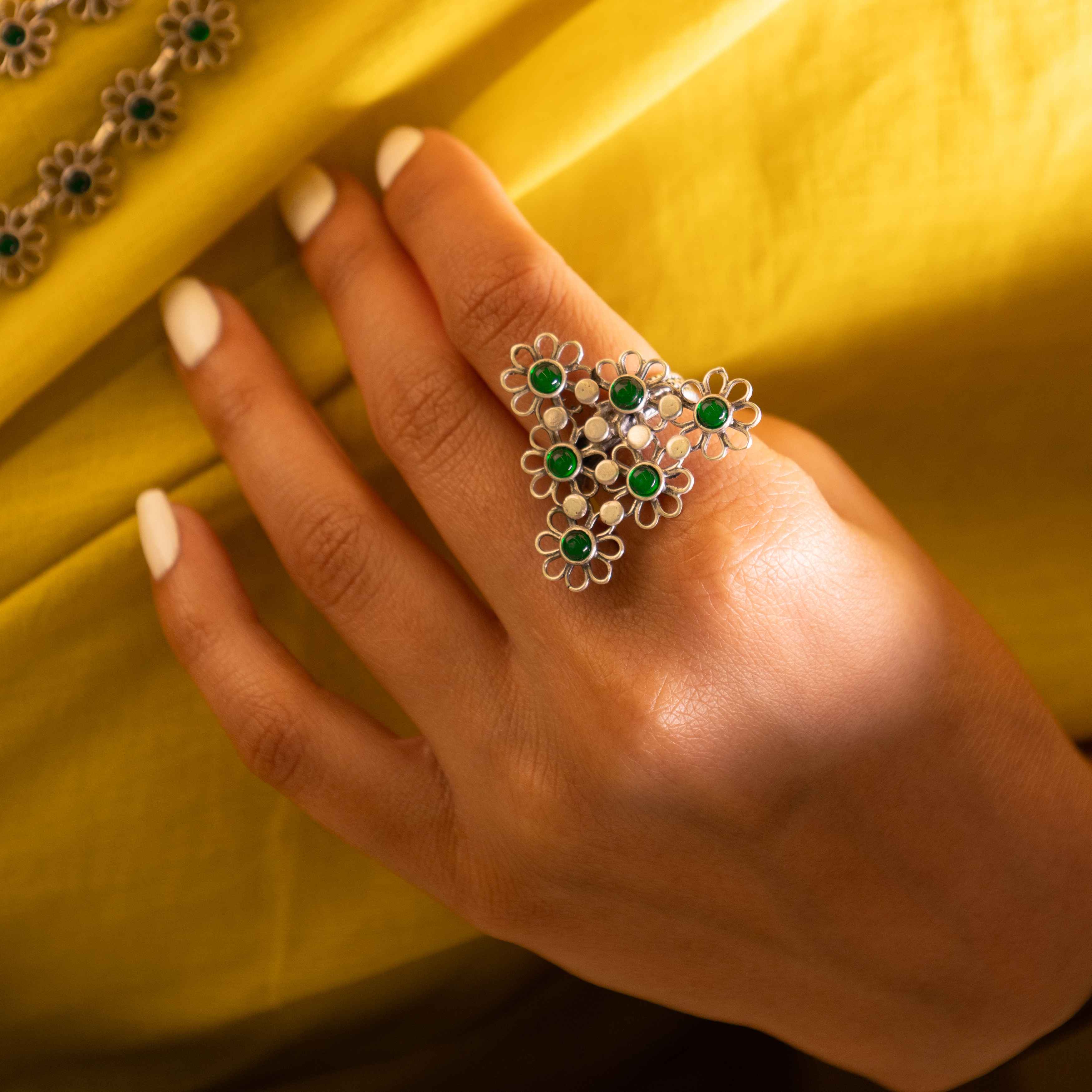 Tattva Carved flower statement green ring