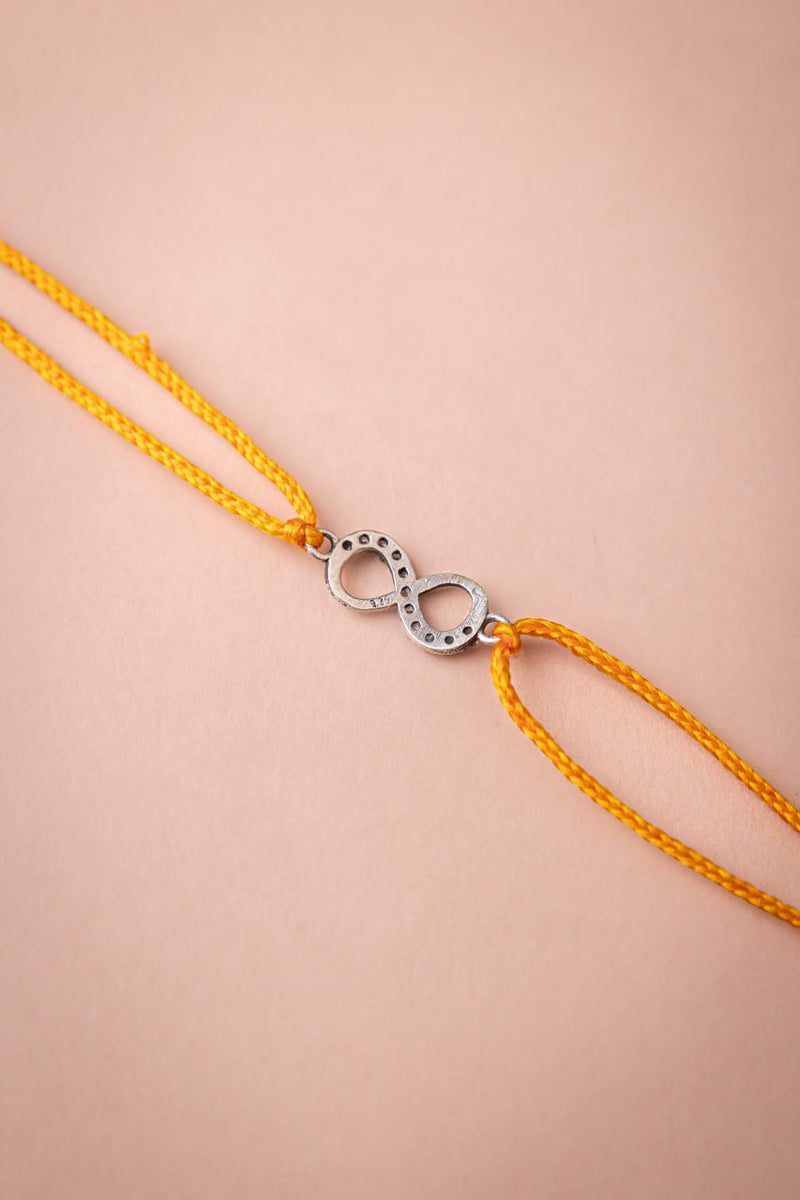 925 pure silver infinity knot rakhi, close-up