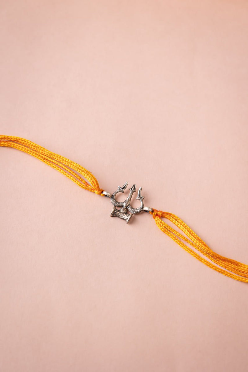 925 pure silver intricate Shiva trishul rakhi, close-up
