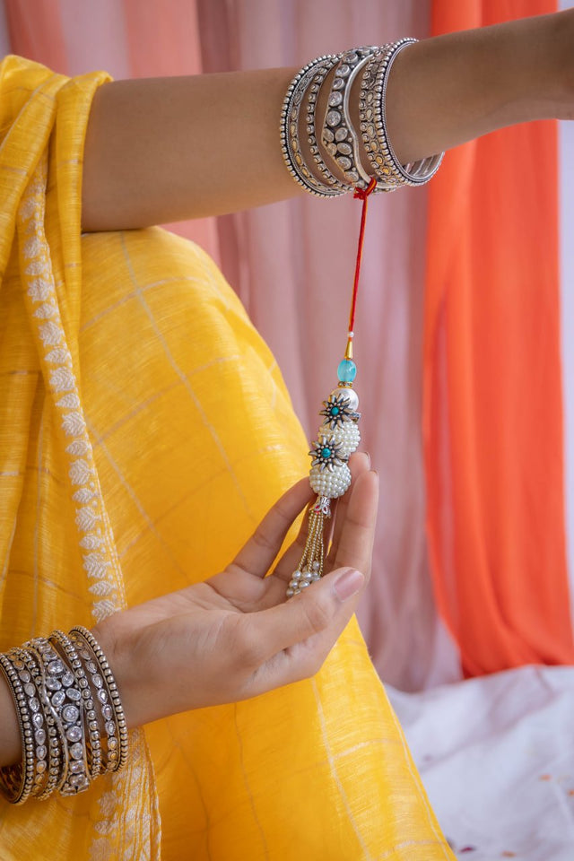 925 pure silver turquoise flower pearl drop lumba rakhi, detail view