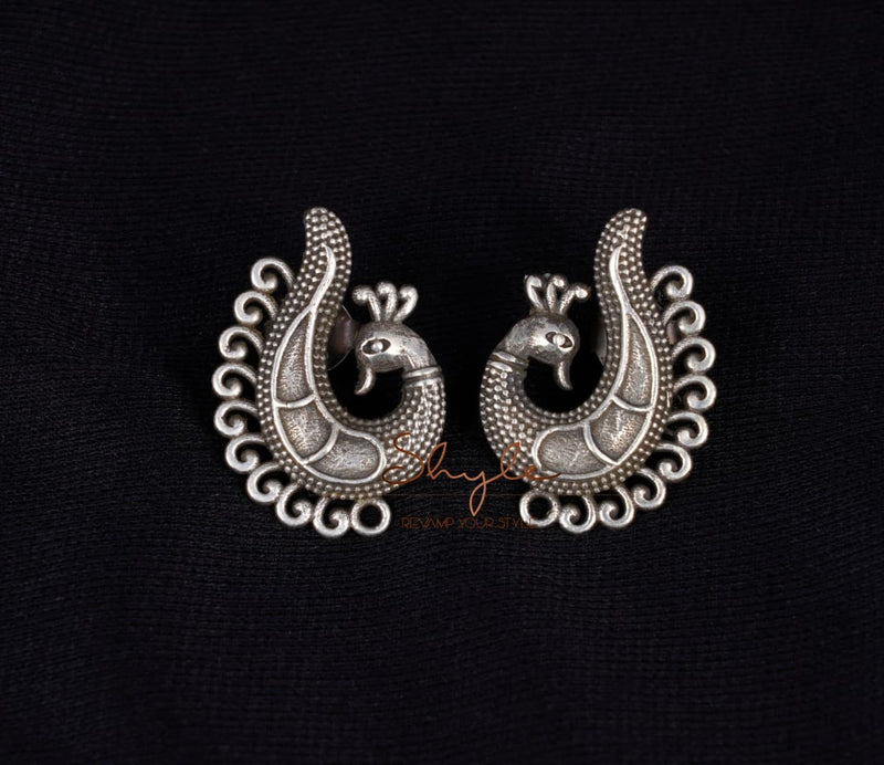 925 pure silver intricate peacock studs, close-up
