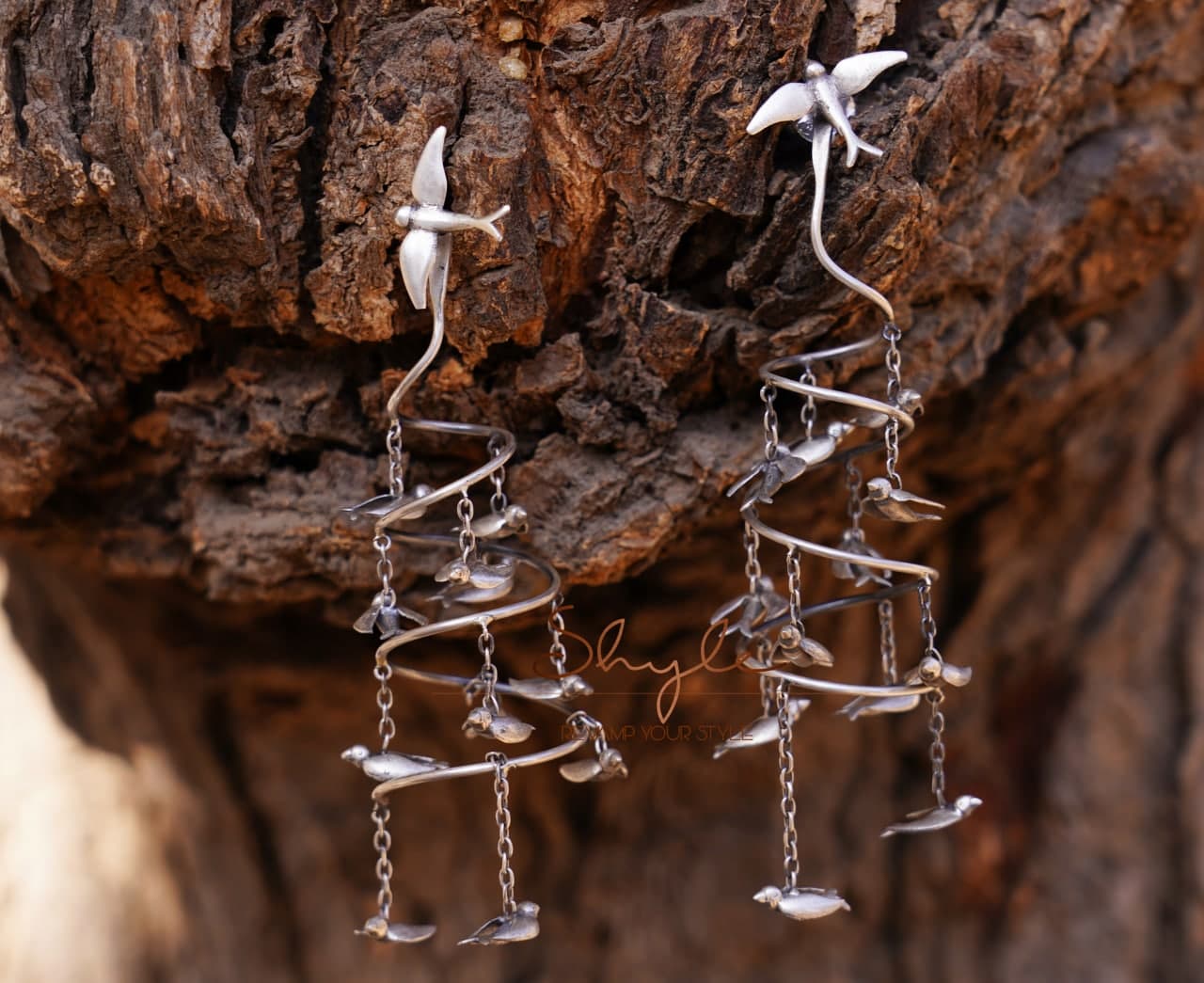 Qurbat Flying Birds Spiral Statement Earring front