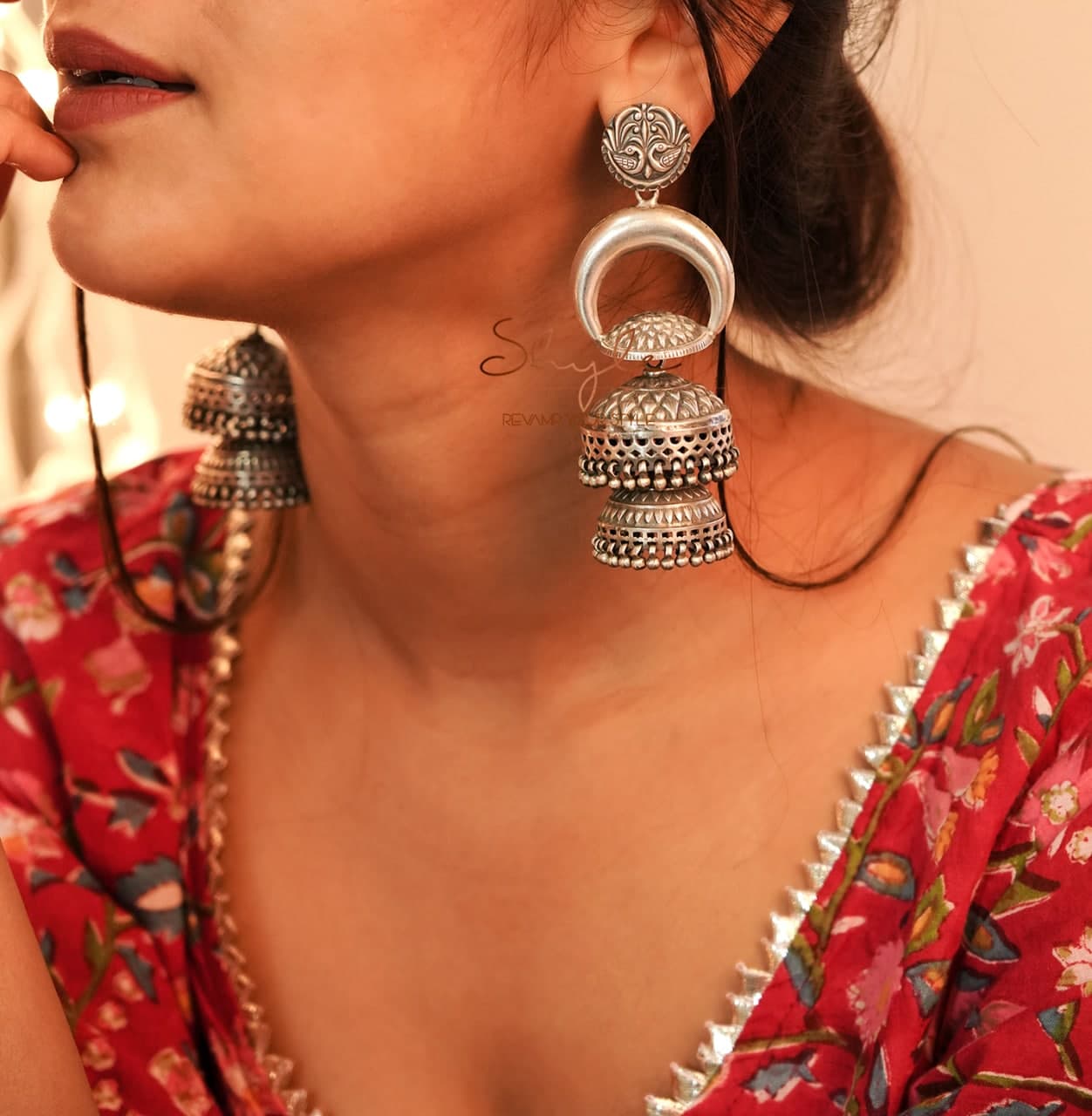 Tattva Peacock Motif Embossed Layered Statement Jhumka model