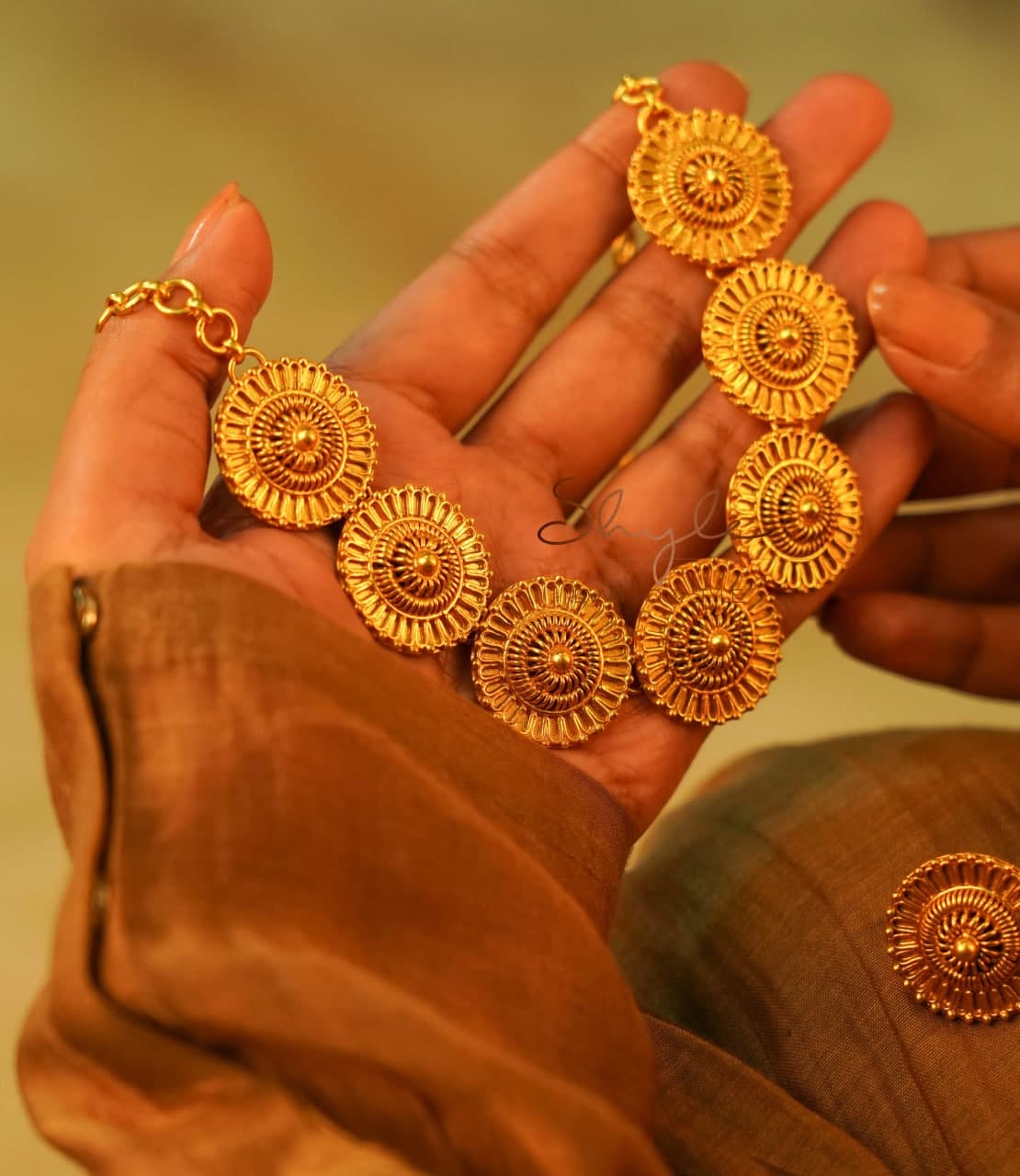 Adya Intricate Motif Sequence Gold Necklace