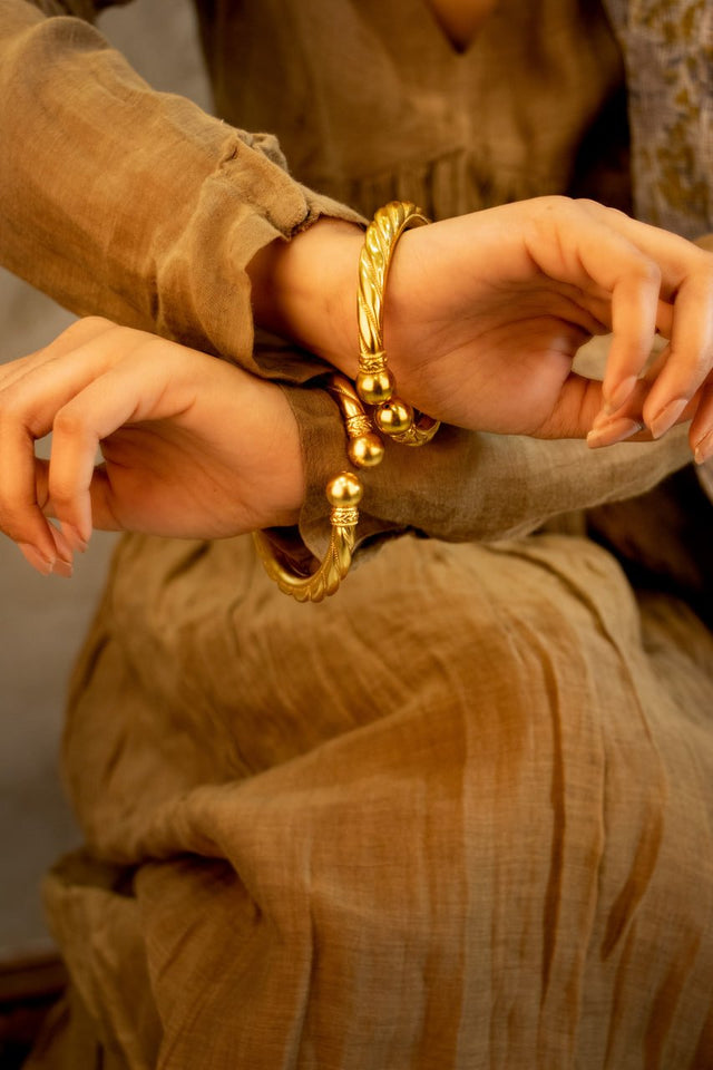 Anvaya Spiral Embossed Gold Tone Kada