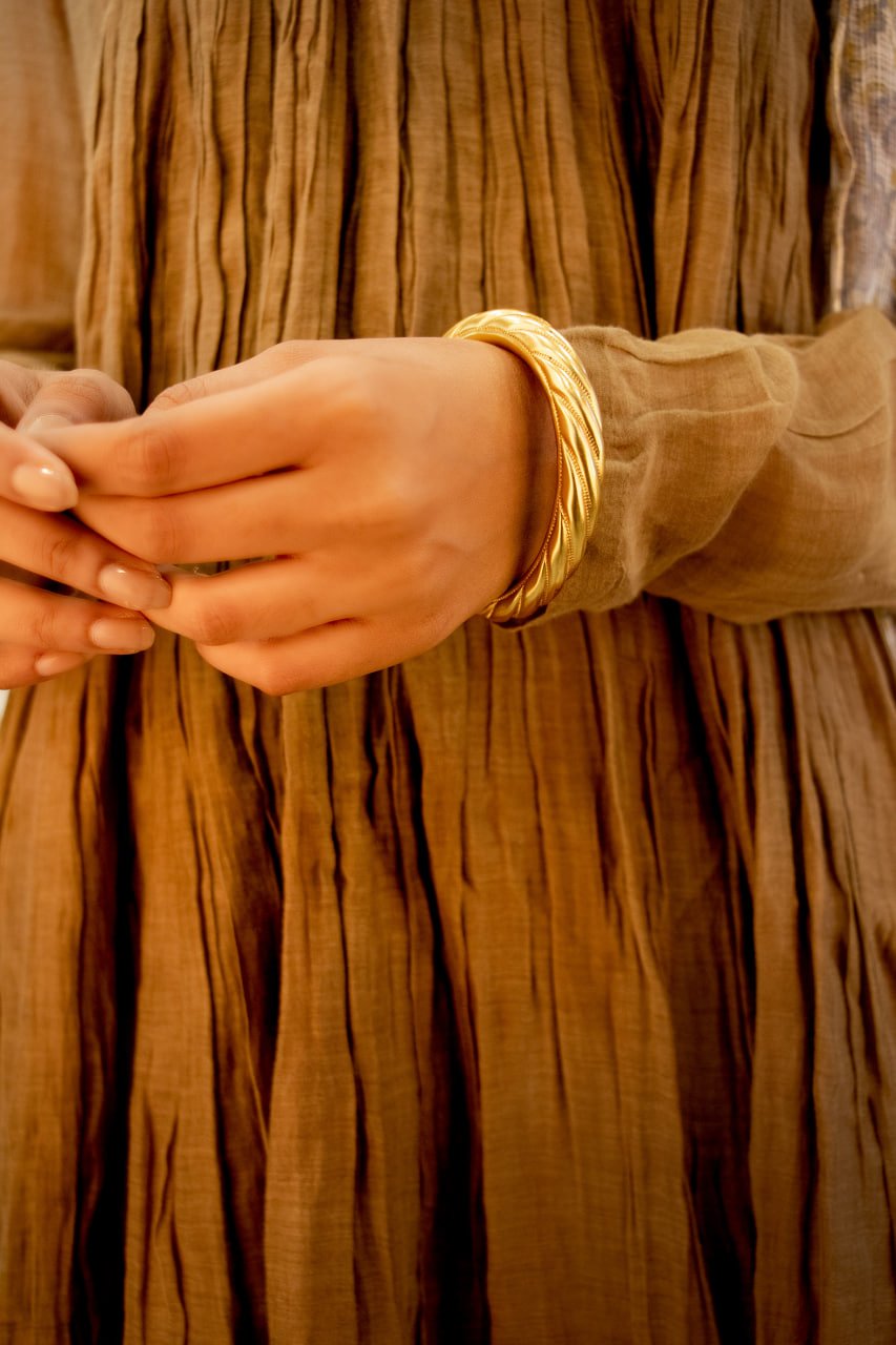 Anvaya Spiral Embossed Gold Tone Kada