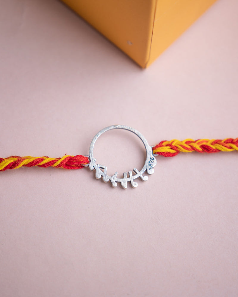 925 pure silver musical note motif rakhi, close-up