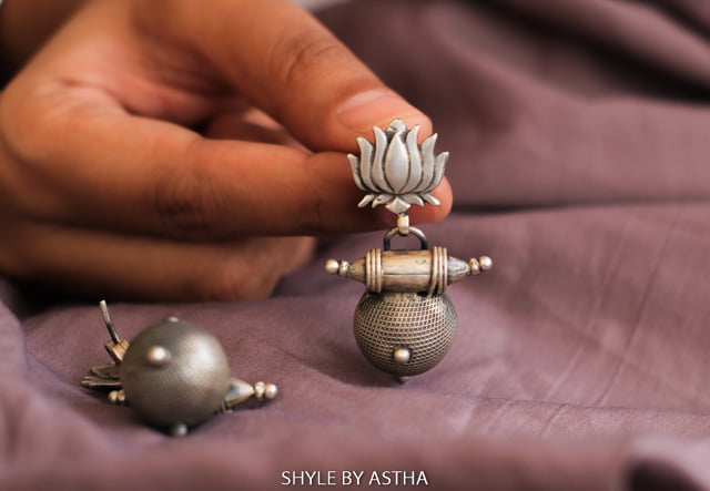 Adya Lotus Motif Textured Drop Earrings