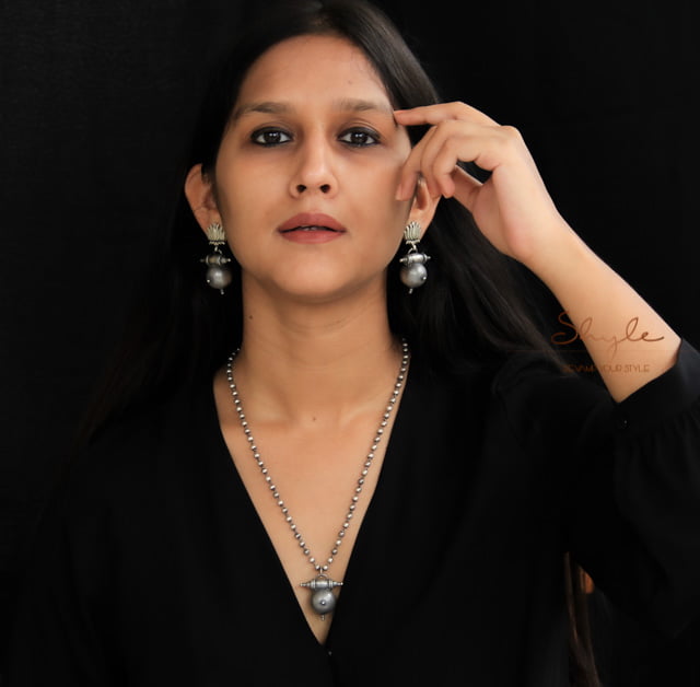 Adya Lotus Motif Textured Drop Earrings