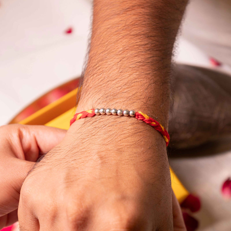 925 pure silver beaded sadabahaar rakhi, close-up