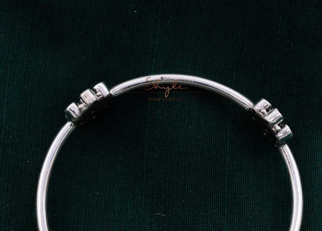 Close-up of 925 hallmark stamp on silver jadau flower bangle