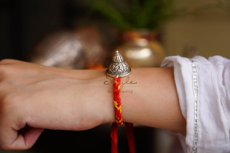 925 pure silver chitai embossed dhaal rakhi, detail view