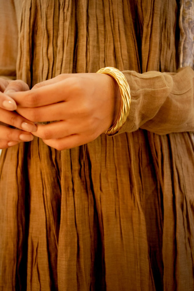 Anvaya Spiral Embossed Gold Tone Kada