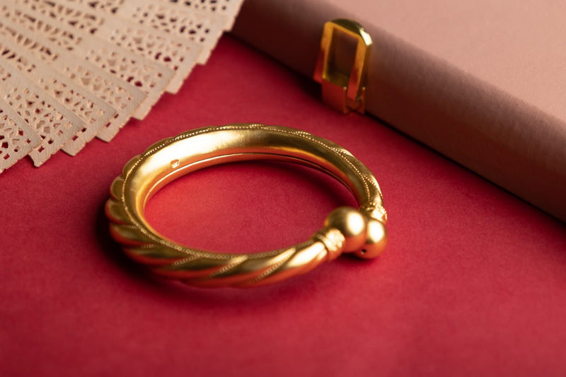 Anvaya Spiral Embossed Gold Tone Kada