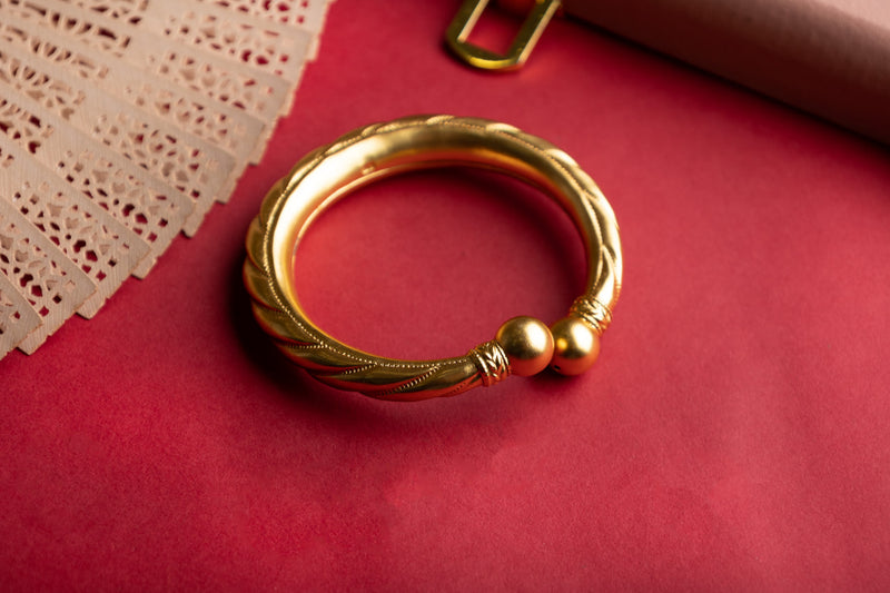 Anvaya Spiral Embossed Gold Tone Kada